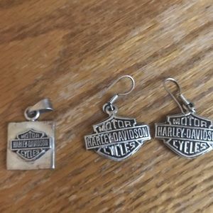 Silver Harley earrings and charm for a necklace.
